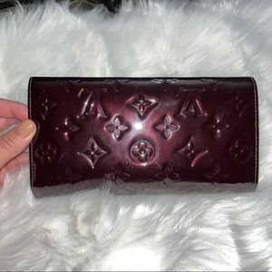 Gently used LV clutch wallet. Eggplant purple with lots of compartments.